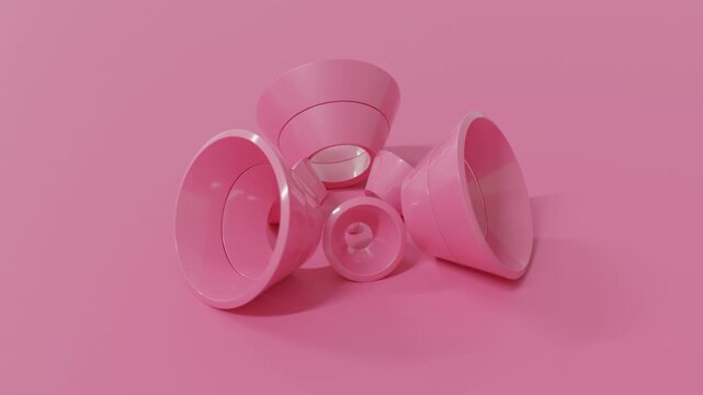 Abstract 3D animation of pink cone fragments rolling across a monochrome surface in a seamless loop. Surreal minimal geometry with futuristic rhythm, clean composition, and elegant motion for modern v