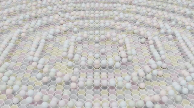 Abstract 3D Animation of Colorful Balls Emerging from Round Pipe Structures with Rhythmic Wave Movement Across Space Futuristic Kinetic Design for Advertising Technology UI and Motion Graphics Content