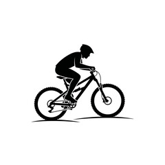 Fototapeta premium Silhouette of a mountain biker riding downhill on a trail.