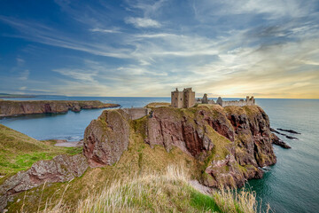 Dunnottar Castle is a medieval castle, now in ruins, perched on a rocky cliff on a headland on the northeast coast of Scotland. United Kingdom © Joan Vadell
