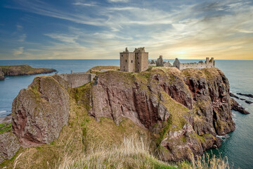 Dunnottar Castle is a medieval castle, now in ruins, perched on a rocky cliff on a headland on the northeast coast of Scotland. United Kingdom © Joan Vadell