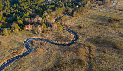 The turn of spring and winter on the Rządza River, Mazovia, Poland © Leszek