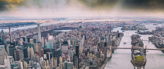 Aerial view of Manhattan buildings and Roosevelt Island on the East River from helicopter