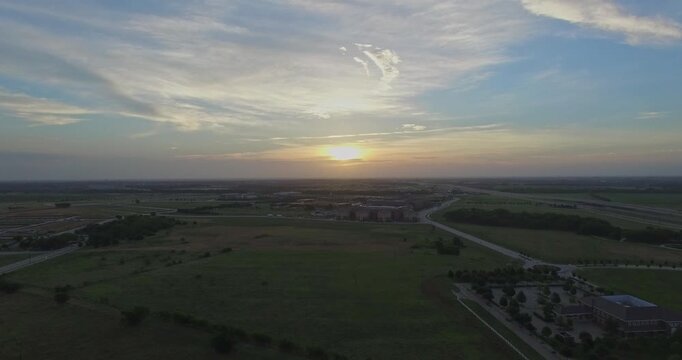 Aerial stationary video of sunrise over McKinney, Texas at Craig Ranch. Shot was captured on July 9, 2016. The view is from over Craig Ranch looking East at the undeveloped land and sprawling space.