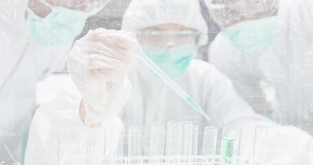 Fototapeta premium Dispensing gloved hand holding pipette at lab bench, in PPE, filling test tubes with green reagent