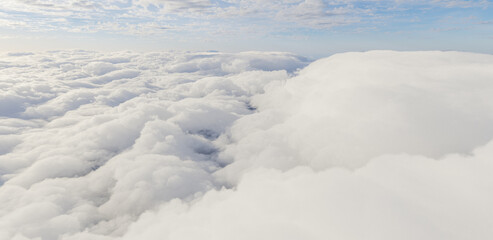Obraz premium Aerial View of Soft White Clouds Under Pale Blue Sky, Serene Cloudscape 3D Rendering