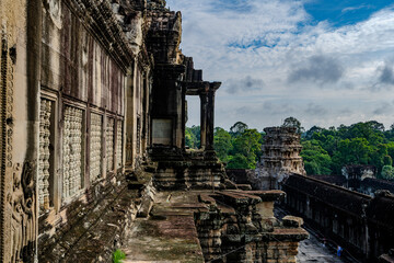 Fototapeta premium Ancient stone gallery of Angkor Wat temple complex in Cambodia