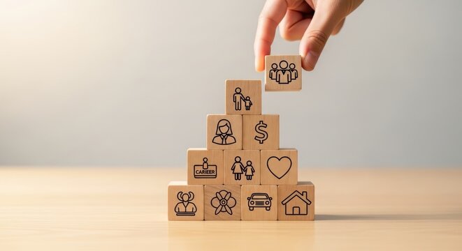 Wooden blocks stack representing human life priorities and goals