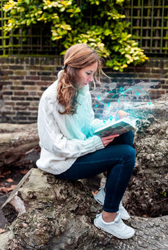 Forward thinking woman reading book with global network map