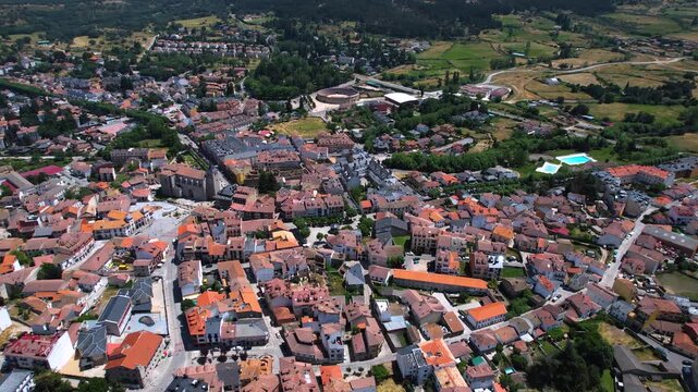 Aerial panorama view of the old town and city El Espinar in Spain on a sunny summer noon.