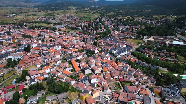 Aerial panorama view of the old town and city El Espinar in Spain on a sunny summer noon.
