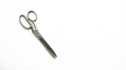 Obraz premium Professional metal scissors on white background for cutting tasks