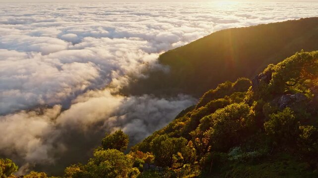 Aerial view of sunrise above clouds on Madeira island, Portugal