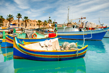 Obraz premium Colorful Fishing Boats Against Dock Background