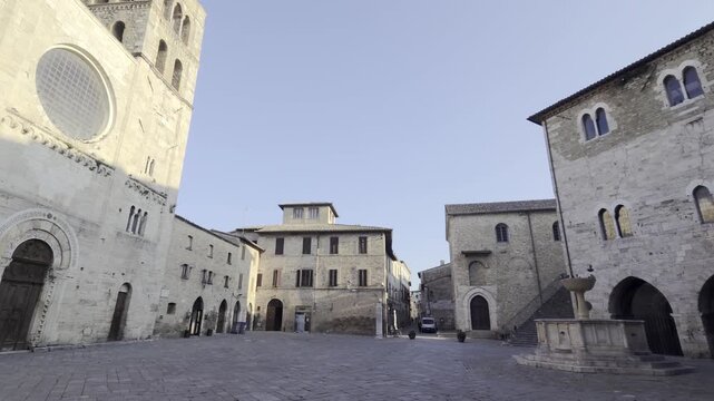 Historic buildings in the square of Bevagna, a medieval village in the Umbria region, Italy.