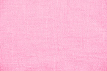 Delicate soft pastel pink terrycloth fabric texture background featuring fluffy cotton material...