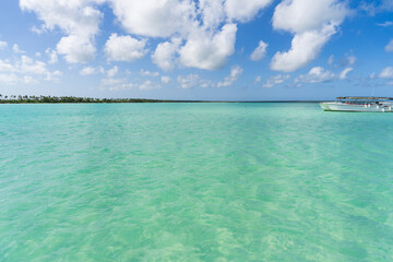 Tourist boat excursion on turquoise sea at sunny day