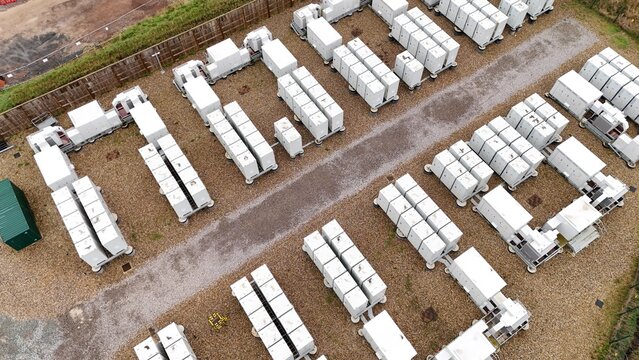 Aerial drone view of a large-scale battery energy storage system (BESS) in Burwell, UK, supporting grid resilience and renewable power supply.