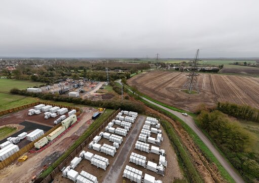 Aerial overview of a major UK battery storage hub in Burwell, illustrating the critical infrastructure used to stabilize electricity networks.