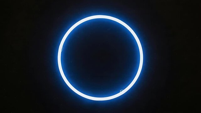 Glowing blue neon light circles a dark planet in a cosmic astronomy design featuring a star and solar eclipse within the vast galaxy universe