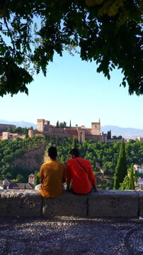 Couple showing famous Alhambra landmark in Granada