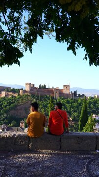 Travelers discovering Alhambra palace in Spain