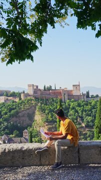 Solo traveler sightseeing Alhambra palace in Granada Spain