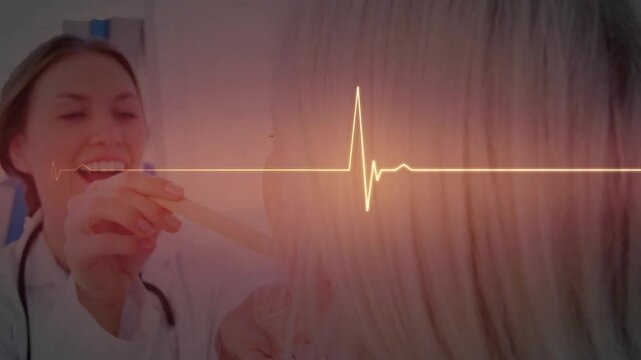 Medical clinician asking patient to open mouth and using tongue depressor while ECG overlay pulsing