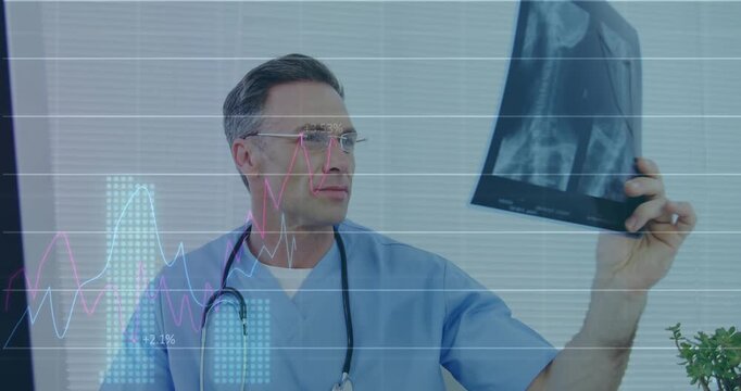 Dr reviewing monitor while holding and rotating X-ray, animated graphs over X-ray showing diagnosis