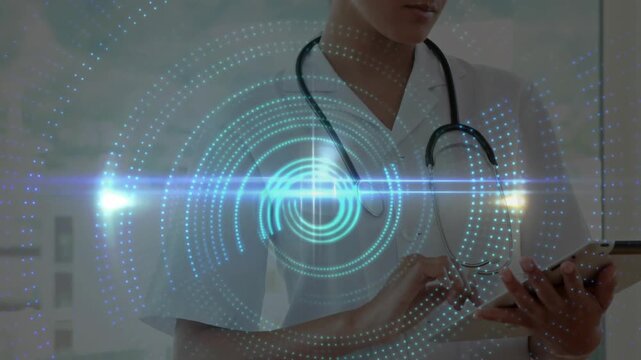 Vertical video: Dr wearing steth tapping tablet starting AR rings forming chest vortex reading data