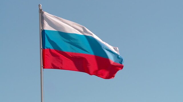 the flag of the Kirov region against the background of a blue summer