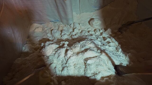Naturally occurring saltwater is collected and stored awaiting boiling.