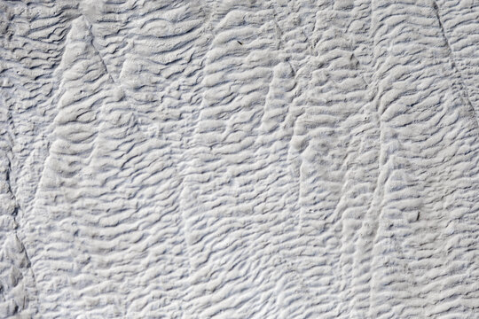 Textured surface detail of natural travertine stone