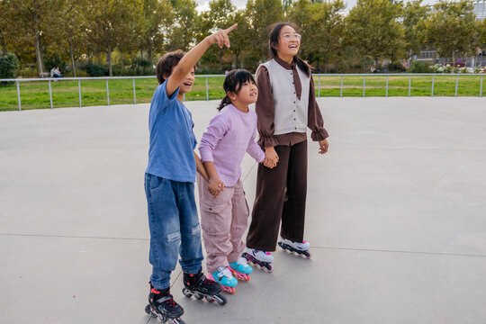 Friends rollerblading in a park and enjoying time together