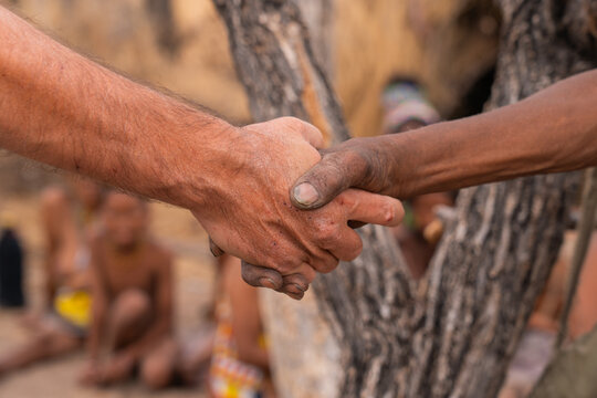 Handshake between different cultures in Namibia