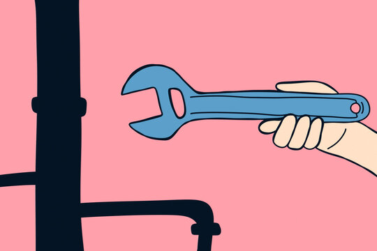Hand holding a wrench fixing plumbing issues