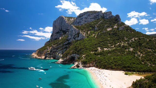 Cala Mariolu Sardinia Aerial Pull-back Reveal. Turquoise Sea with Tourist Boats and White Sand Beach. Orosei Gulf Italy. Cinematic Coastline with Giant Limestone Cliffs 4K