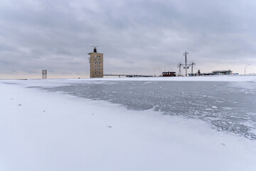 radar tower and wind semaphore in Cuxhaven, Germany at the river Elbe on a frosty winter day