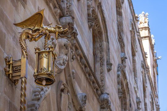 Dragon-shaped lantern on ornate historic building facade