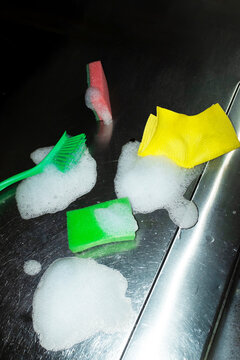 Cleaning supplies with sponges, brush and foam