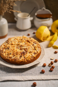 Apple crumble cake with hazelnuts on a table
