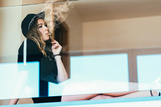 Woman enjoying a joint in casual attire