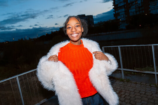 Gen Z girl in vibrant flash portrait outdoors