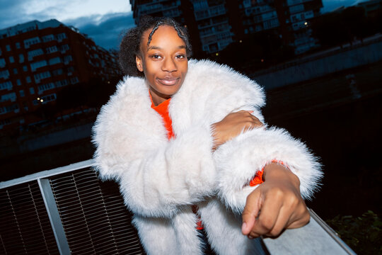 Gen Z girl in stylish portrait with urban backdrop