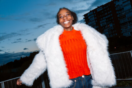 Gen Z girl in vibrant city flash portrait