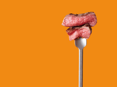Delicious steak piece on fork promoting keto diet