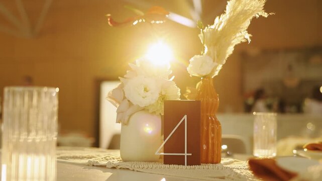 Intimate wedding centerpiece glowing with candlelight, wedding decor rustic gold backlight with pampas