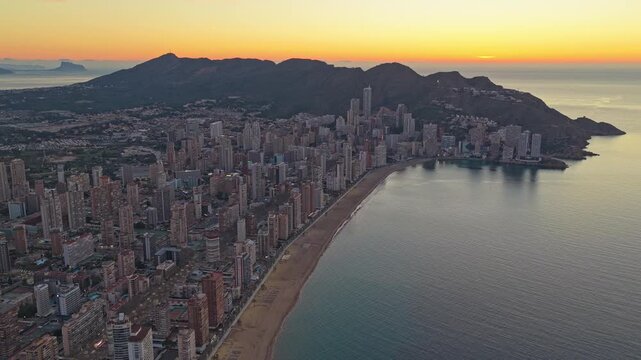 Aerial view of benidorm cityscape at sunrise in spain