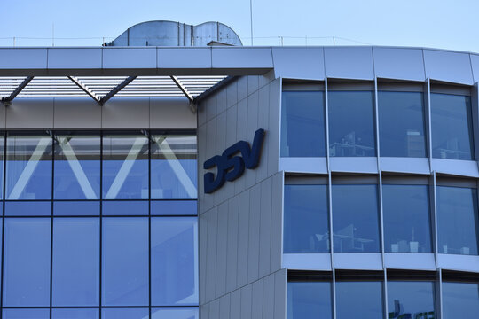 DSV International Shared Services company logo, signage on the office facade, Danish transport and logistics company. WARSAW, POLAND - APRIL 13, 2025