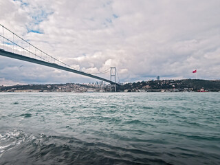 Fototapeta premium Bosphorus Bridge and Turkish Flag View from Beylerbeyi Istanbul